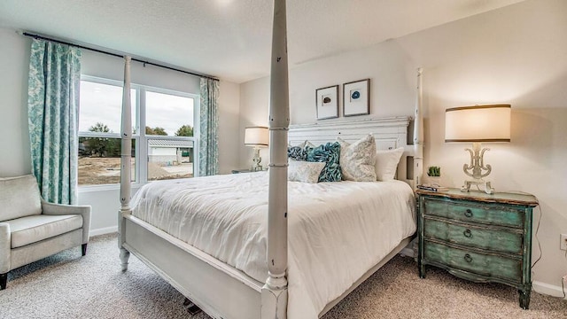 bedroom with light colored carpet