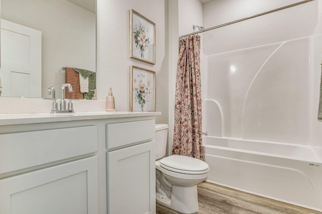 full bathroom featuring toilet, vanity, shower / bath combo, and hardwood / wood-style flooring