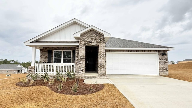 craftsman-style house featuring covered porch and a garage