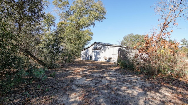 view of side of property featuring an outdoor structure