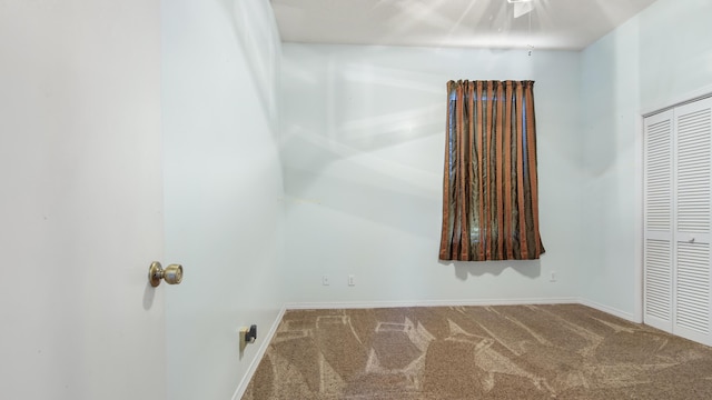 unfurnished room featuring carpet flooring