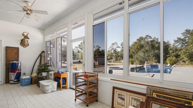 sunroom featuring a wealth of natural light and ceiling fan