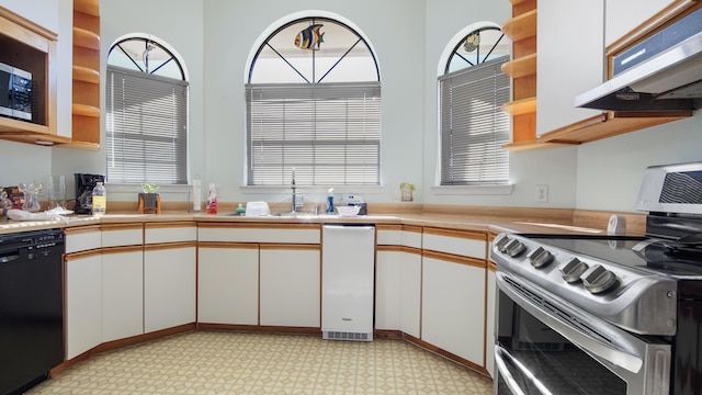 kitchen featuring white cabinets, stainless steel appliances, and sink