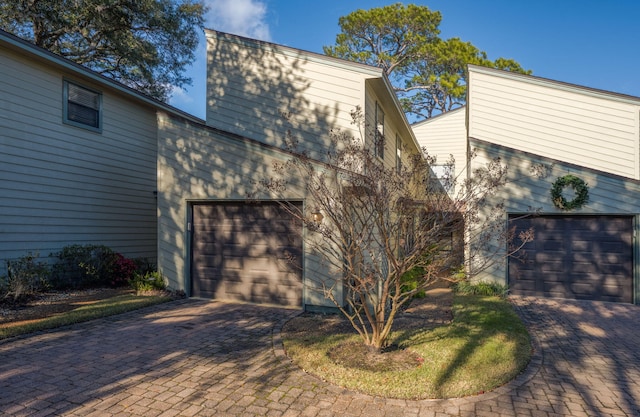 view of side of home with a garage