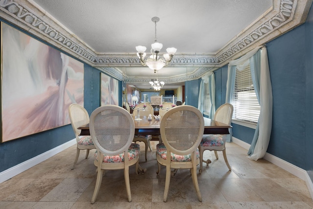 dining area featuring crown molding and a chandelier