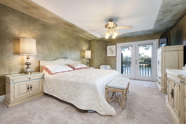 carpeted bedroom with ceiling fan, access to outside, and french doors