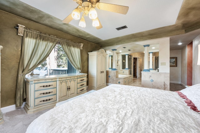 carpeted bedroom featuring ceiling fan and decorative columns