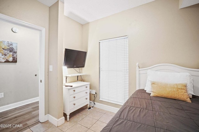 bedroom with light tile patterned flooring