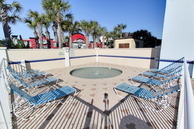 view of patio featuring a community hot tub