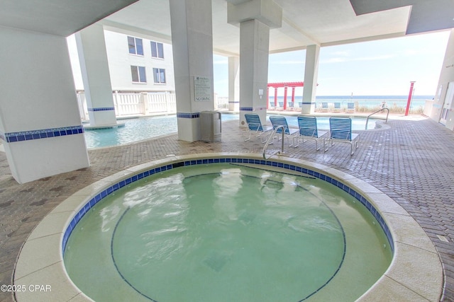 view of pool featuring an indoor hot tub