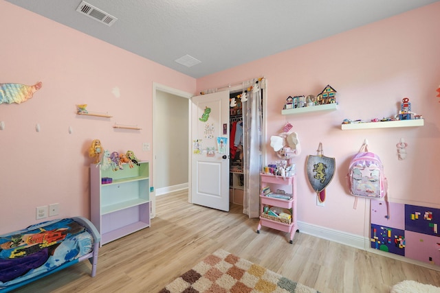 bedroom with light hardwood / wood-style floors