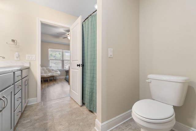 bathroom with ceiling fan, vanity, and toilet