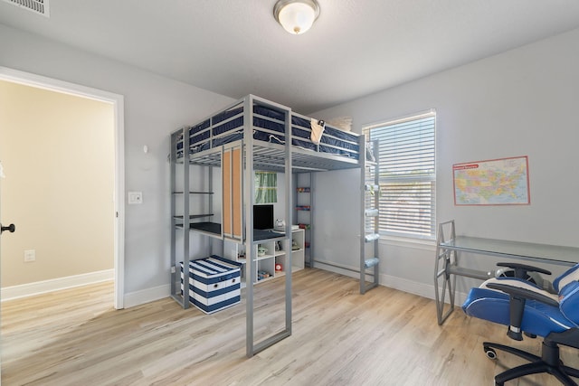 bedroom featuring hardwood / wood-style floors