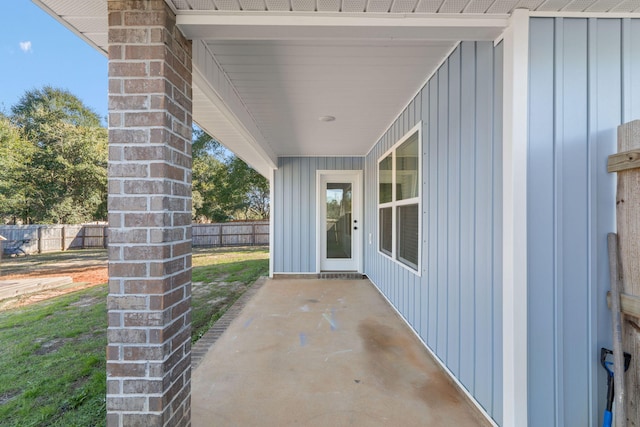 entrance to property featuring a patio area