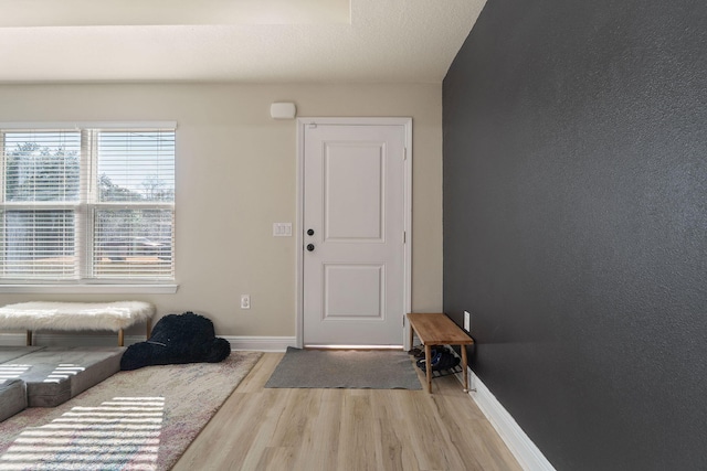 foyer with light wood-type flooring