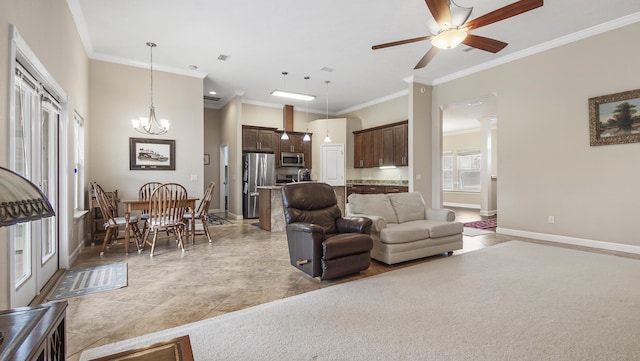 living room with crown molding and ceiling fan with notable chandelier