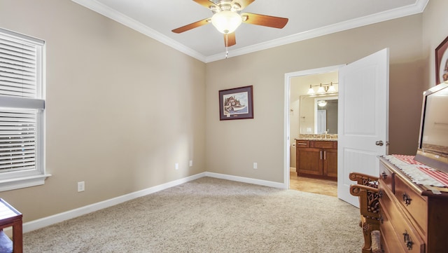 carpeted bedroom featuring connected bathroom, ceiling fan, sink, and ornamental molding