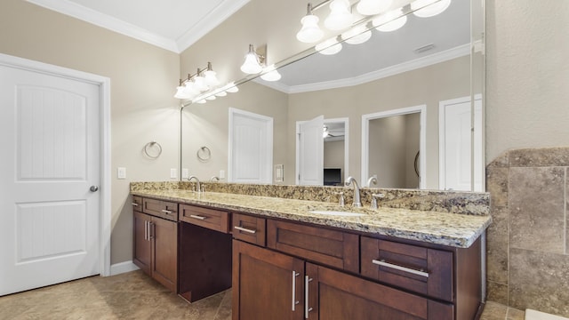 bathroom with vanity, ceiling fan, and ornamental molding