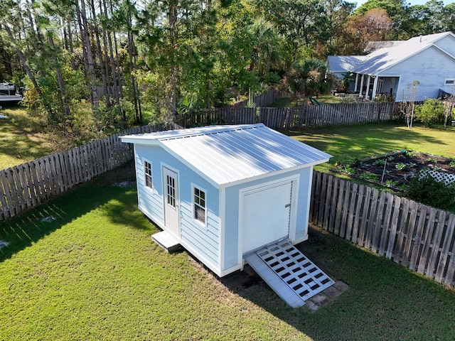 view of outdoor structure with a yard