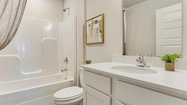 full bathroom with toilet, vanity, and washtub / shower combination