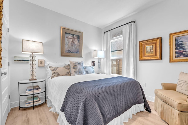 bedroom with light hardwood / wood-style floors