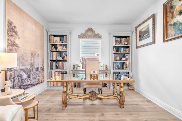 office with light hardwood / wood-style flooring