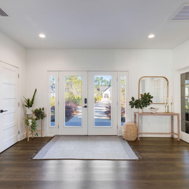 entryway featuring dark hardwood / wood-style flooring and french doors