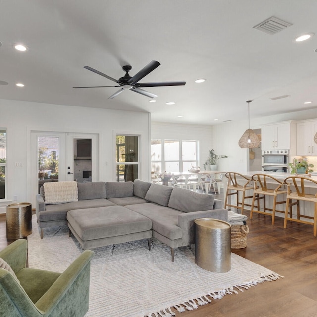 living room with ceiling fan, french doors, and hardwood / wood-style flooring