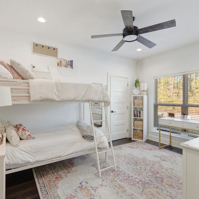 bedroom with ceiling fan and wood-type flooring