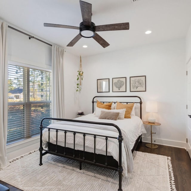 bedroom with wood-type flooring and ceiling fan