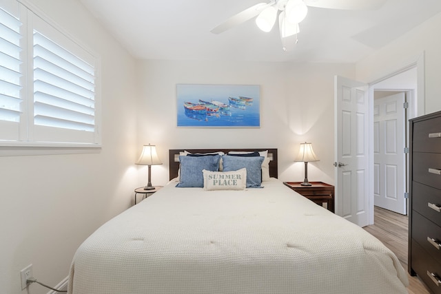 bedroom featuring light hardwood / wood-style floors and ceiling fan