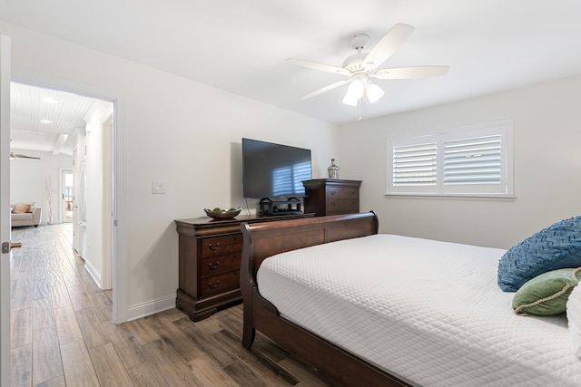 bedroom with hardwood / wood-style flooring and ceiling fan