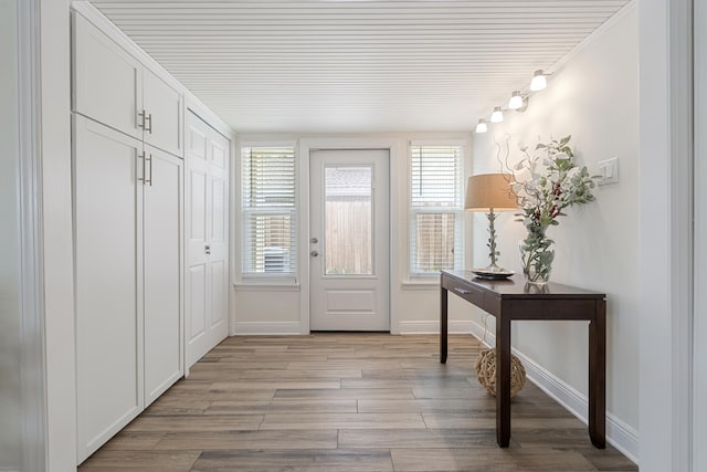 entryway with light hardwood / wood-style floors