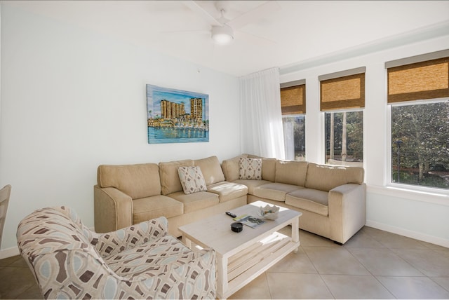 living room featuring ceiling fan and light tile patterned floors