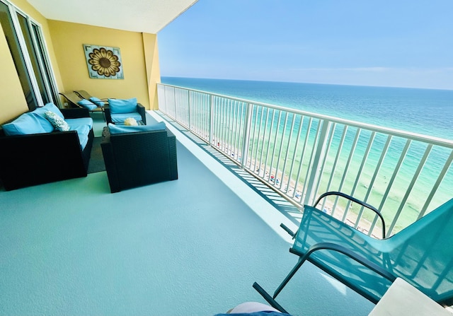 balcony with outdoor lounge area and a water view