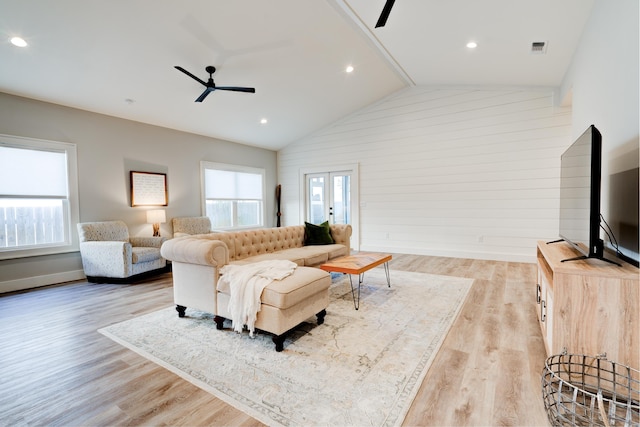 living room with ceiling fan, a healthy amount of sunlight, and light hardwood / wood-style floors