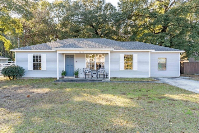 view of front of property with covered porch and a front lawn