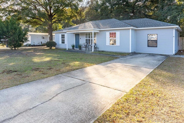 single story home with a front lawn and covered porch