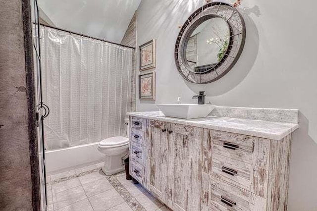 full bathroom featuring toilet, vanity, vaulted ceiling, and shower / bath combo with shower curtain