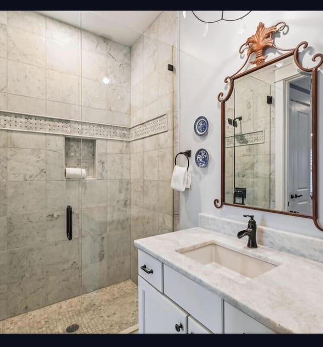 bathroom featuring vanity and walk in shower