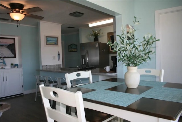 dining room featuring ceiling fan and crown molding