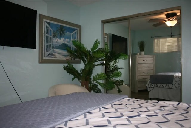 bedroom featuring ceiling fan and a closet