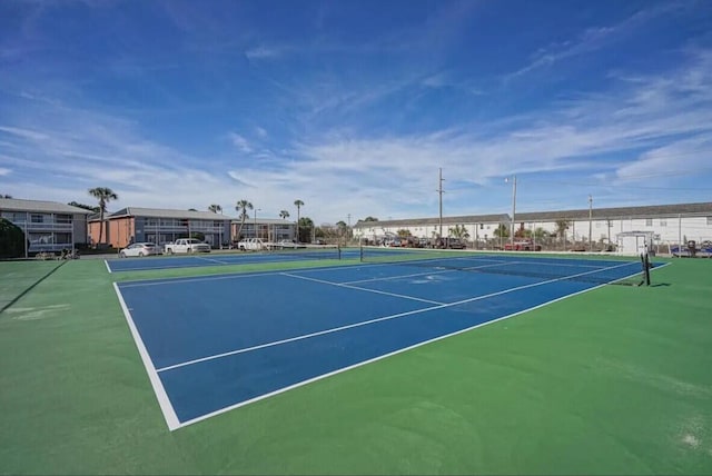 view of tennis court featuring basketball court