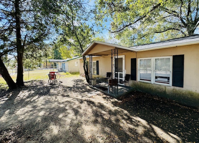 rear view of house with a patio