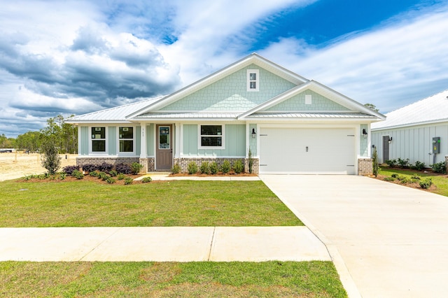 363 Bear Creek Blvd, Freeport, FL 32439 - craftsman house featuring an attached garage, board and batten siding, driveway, a front lawn, and brick siding