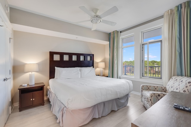 bedroom with ceiling fan and light hardwood / wood-style flooring