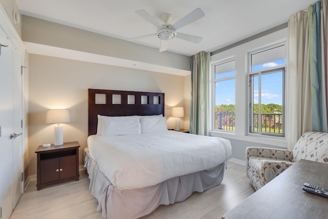 bedroom with ceiling fan and light wood-type flooring