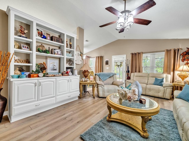 living room with light wood-type flooring, vaulted ceiling, and ceiling fan