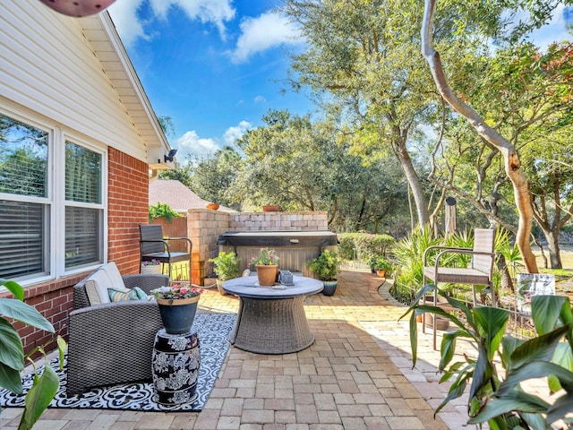 view of patio / terrace featuring a hot tub