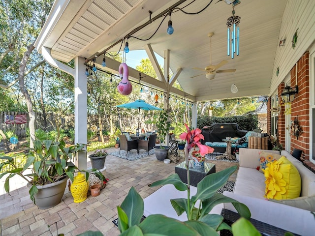 view of patio / terrace with an outdoor living space, ceiling fan, and a grill